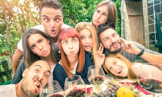 Group of young adults all pulling the funniest faces they can